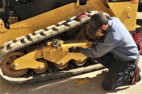 cat mini excavator track adjustment|adjusting track tension for excavators.